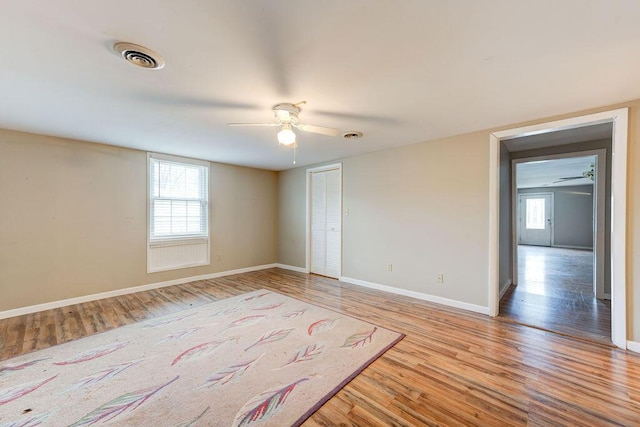 spare room featuring light wood-type flooring and a wealth of natural light