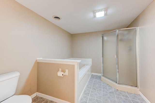 bathroom with toilet and plus walk in shower