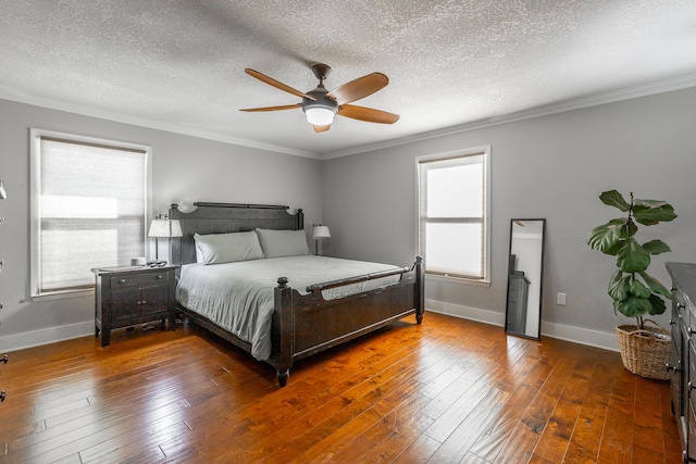 bedroom featuring ceiling fan, dark hardwood / wood-style floors, and multiple windows