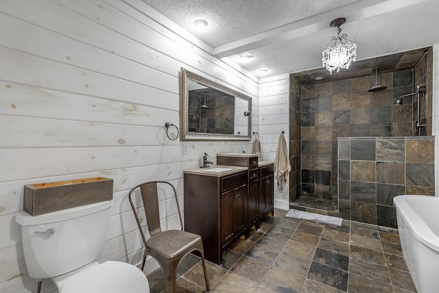 full bathroom with toilet, vanity, wood walls, independent shower and bath, and a textured ceiling