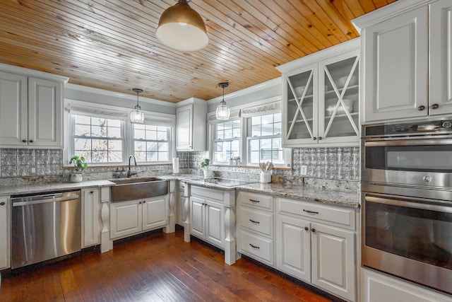 kitchen with stainless steel appliances, wood ceiling, white cabinetry, and decorative light fixtures