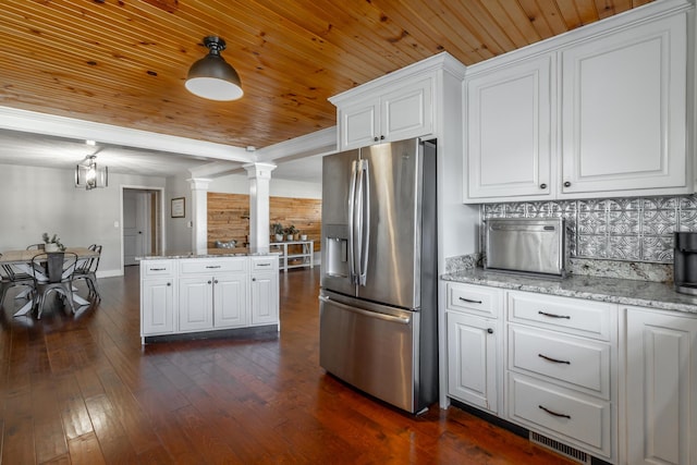 kitchen with stainless steel refrigerator with ice dispenser, wooden ceiling, pendant lighting, and white cabinets