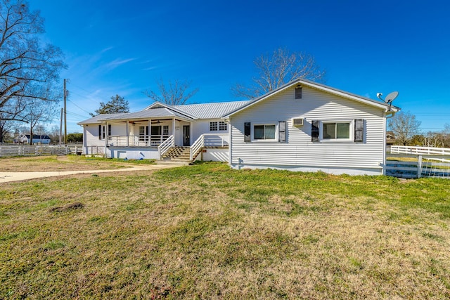 single story home with a front lawn and a porch