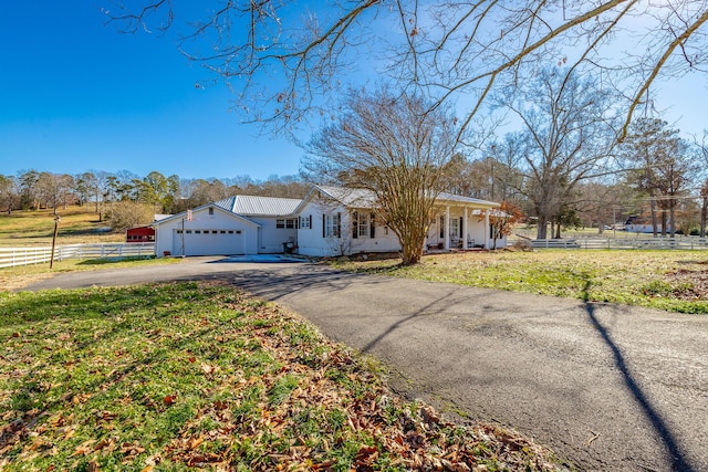 ranch-style house with a front lawn and a garage