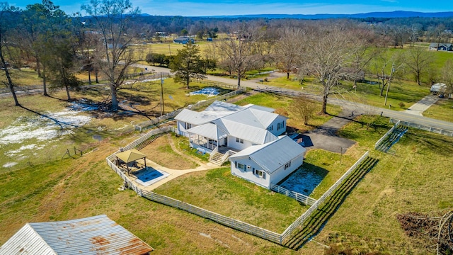 birds eye view of property featuring a mountain view