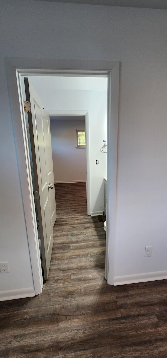 hall with dark hardwood / wood-style flooring