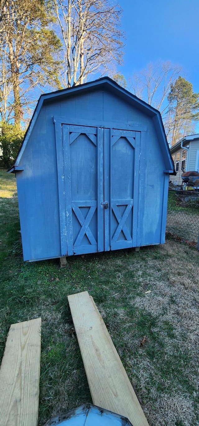 view of outbuilding with a lawn