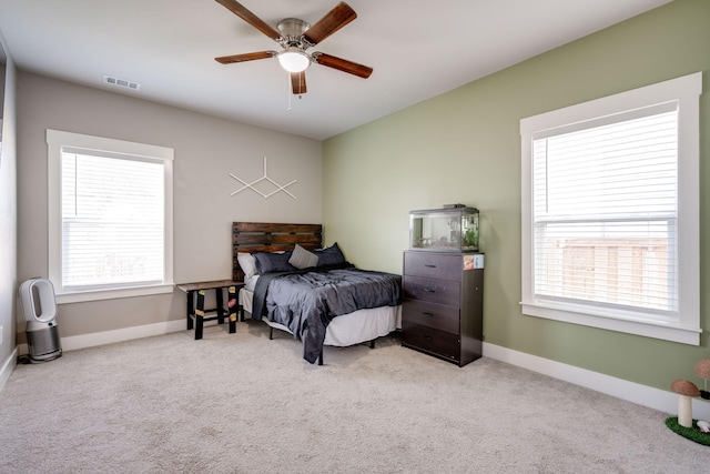 bedroom featuring ceiling fan and light colored carpet