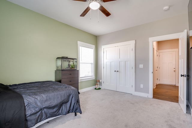 carpeted bedroom with ceiling fan