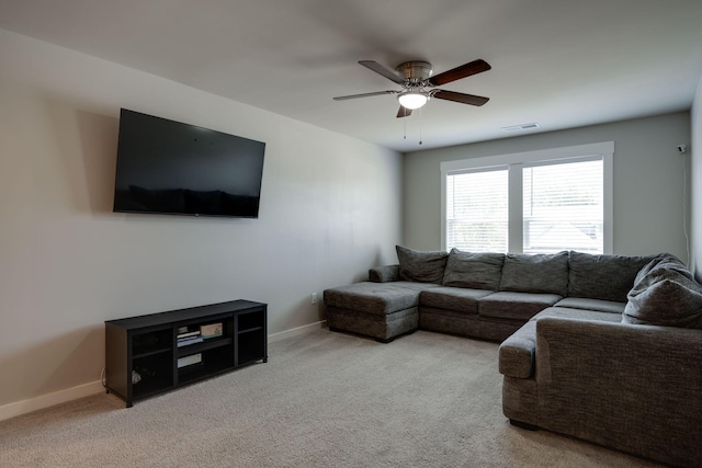 living room with carpet flooring and ceiling fan