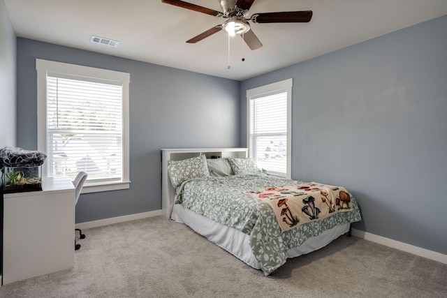 carpeted bedroom with ceiling fan