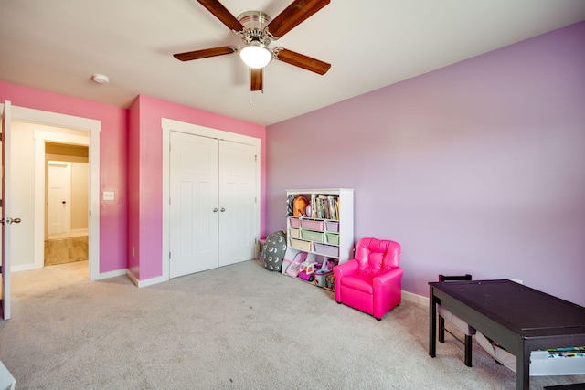 rec room with ceiling fan and light carpet