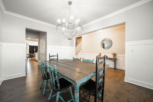 dining space featuring a notable chandelier, dark hardwood / wood-style floors, and ornamental molding