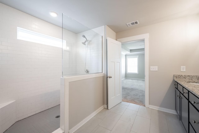 8784 Snowy Owl Rd, Ooltewah, TN 37363 - bathroom featuring visible vents, baseboards, walk in shower, and vanity