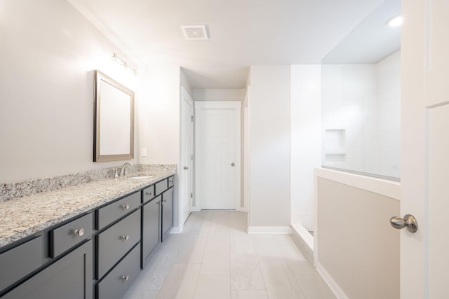 8784 Snowy Owl Rd, Ooltewah, TN 37363 - full bathroom featuring walk in shower, vanity, tile patterned floors, baseboards, and visible vents