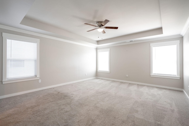8784 Snowy Owl Rd, Ooltewah, TN 37363 - empty room with a raised ceiling, baseboards, light carpet, and a ceiling fan