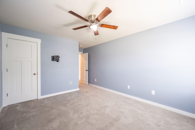 8784 Snowy Owl Rd, Ooltewah, TN 37363 - unfurnished room with light colored carpet, a ceiling fan, and baseboards