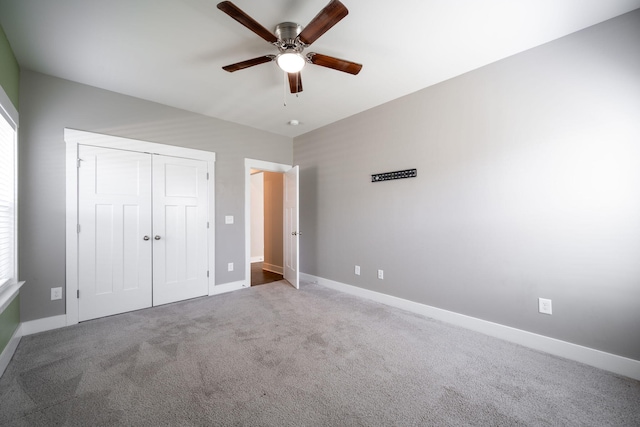 8784 Snowy Owl Rd, Ooltewah, TN 37363 - unfurnished bedroom featuring baseboards, carpet flooring, a ceiling fan, and a closet