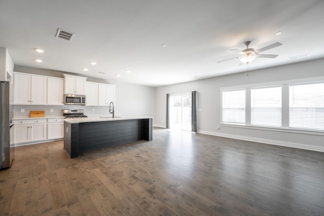 8784 Snowy Owl Rd, Ooltewah, TN 37363 - kitchen featuring visible vents, open floor plan, ceiling fan, dark wood finished floors, and appliances with stainless steel finishes