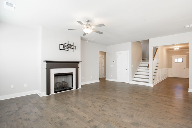 8784 Snowy Owl Rd, Ooltewah, TN 37363 - unfurnished living room featuring a ceiling fan, visible vents, a brick fireplace, wood finished floors, and stairway