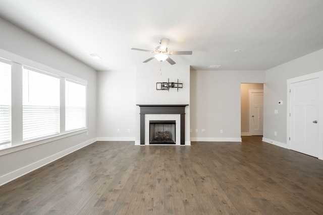 8784 Snowy Owl Rd, Ooltewah, TN 37363 - unfurnished living room with a ceiling fan, visible vents, a fireplace, baseboards, and dark wood-style floors