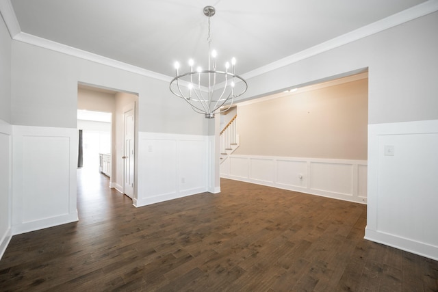8784 Snowy Owl Rd, Ooltewah, TN 37363 - unfurnished dining area featuring crown molding, dark wood-style flooring, a wainscoted wall, and a chandelier