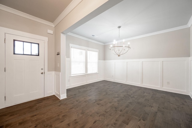 8784 Snowy Owl Rd, Ooltewah, TN 37363 - entrance foyer with a notable chandelier, ornamental molding, a wainscoted wall, and a decorative wall