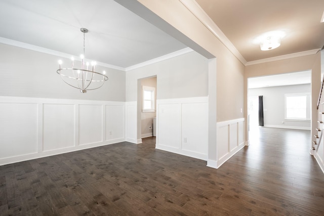 8784 Snowy Owl Rd, Ooltewah, TN 37363 - unfurnished dining area featuring a chandelier, plenty of natural light, ornamental molding, and a decorative wall