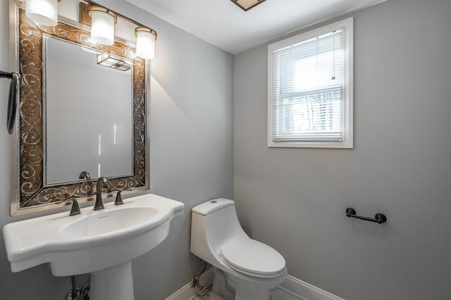 bathroom with toilet and sink