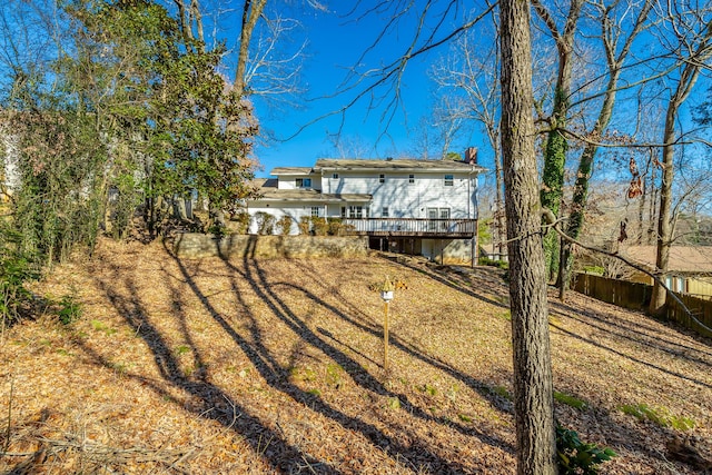 rear view of property with a wooden deck