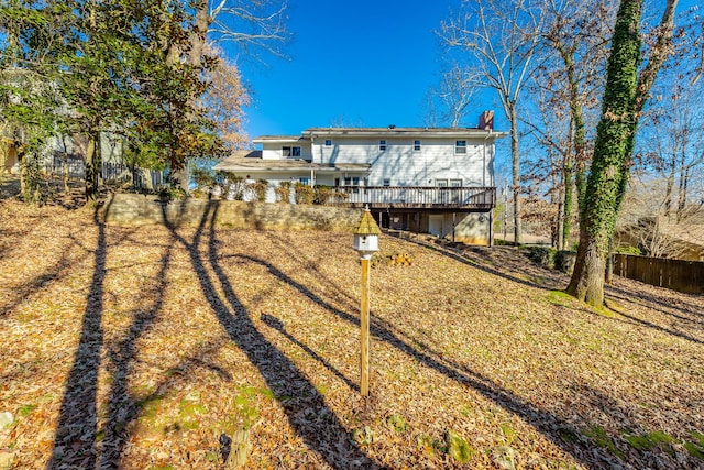 rear view of house with a wooden deck