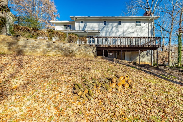 back of house with a wooden deck