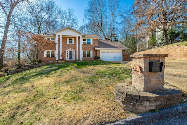 neoclassical / greek revival house with a front yard and a garage