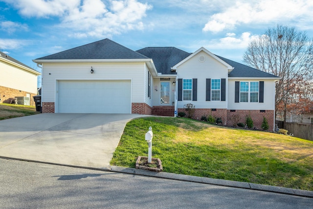 view of front of property featuring a front yard and a garage