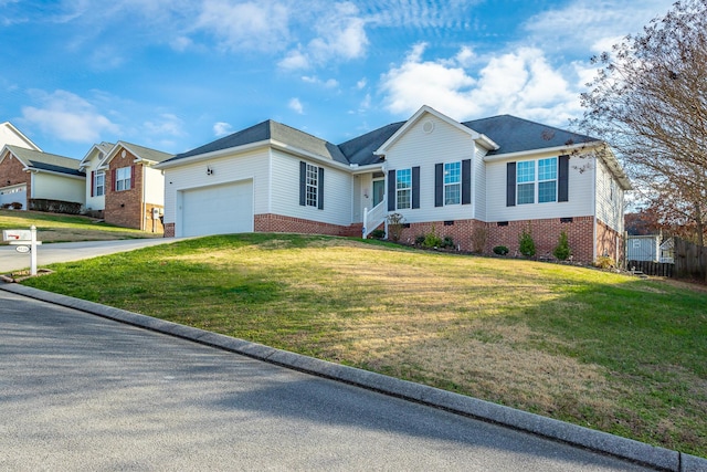 view of front of house featuring a front lawn and a garage