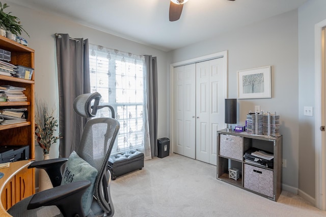 office area featuring ceiling fan and light colored carpet