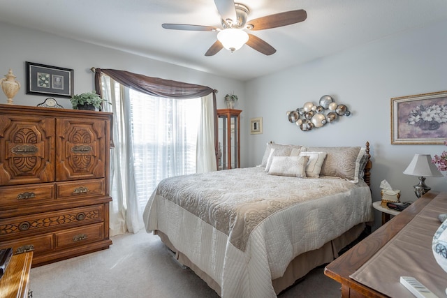 bedroom featuring ceiling fan and light colored carpet