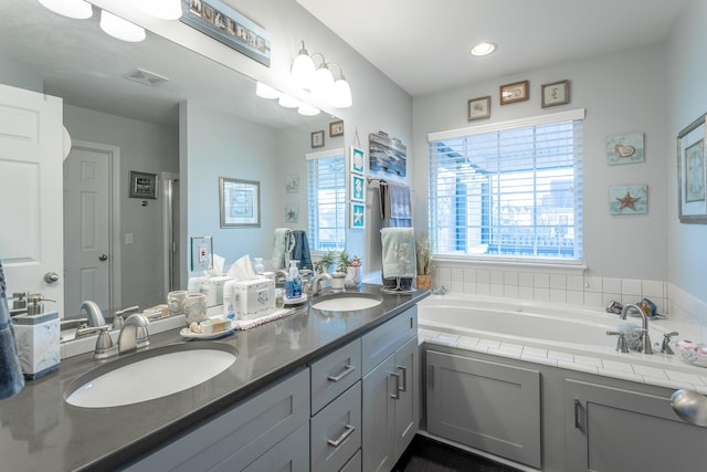 bathroom with a bathtub and vanity