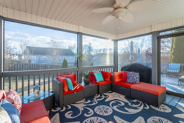 sunroom with ceiling fan and plenty of natural light