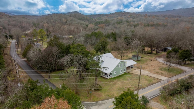 birds eye view of property featuring a mountain view