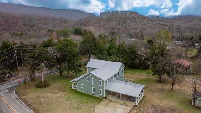 birds eye view of property with a mountain view