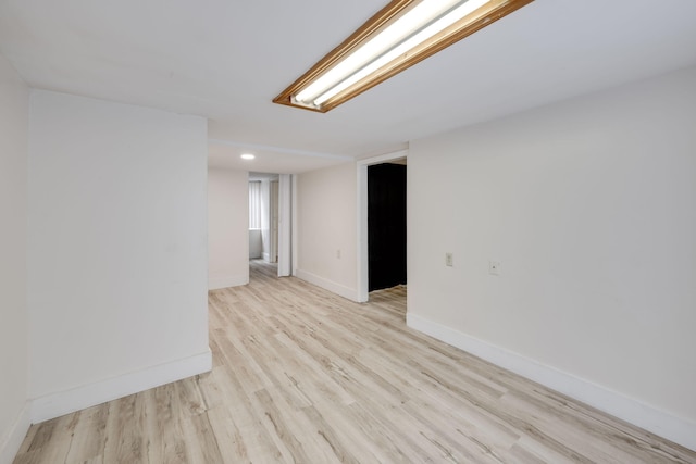 spare room with light hardwood / wood-style floors