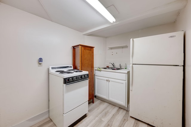 kitchen featuring light wood-type flooring, white cabinetry, sink, and white appliances