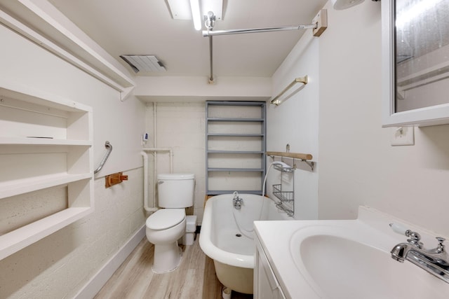 bathroom featuring hardwood / wood-style flooring, toilet, and vanity