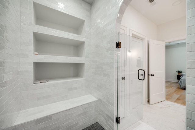 bathroom with an enclosed shower