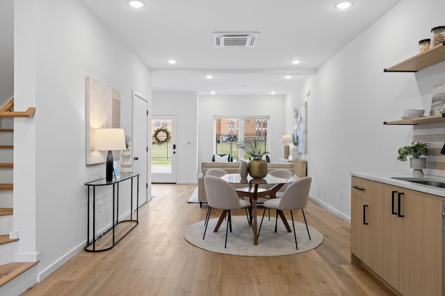 dining room featuring light hardwood / wood-style floors and sink