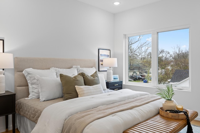 bedroom with hardwood / wood-style floors