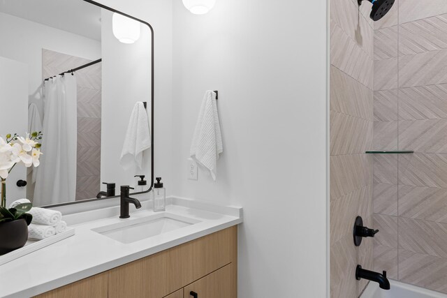 bathroom featuring vanity and shower / bath combo