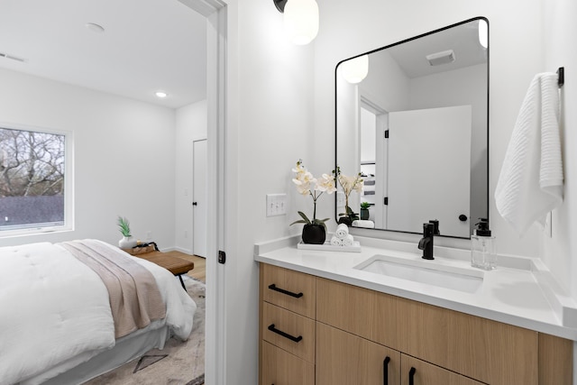 bathroom featuring vanity and hardwood / wood-style flooring