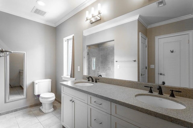 bathroom featuring tile patterned floors, crown molding, a shower with door, and vanity